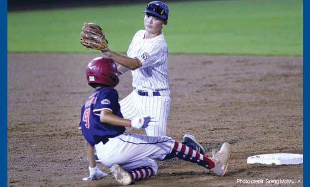 El Segundo Little League player looking to tag out opponent at base