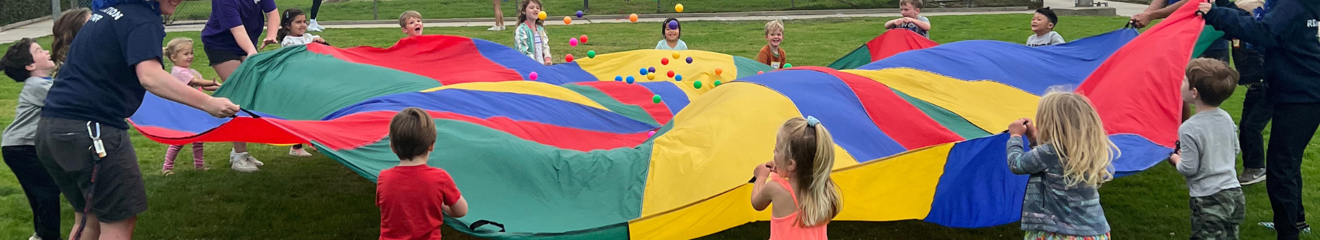 Kids playing with parachute